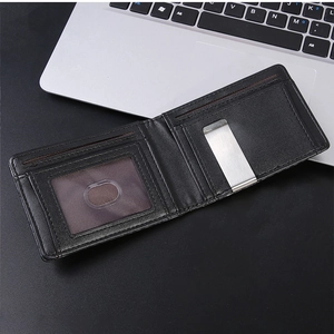 Detail of slim carbon fiber wallet featuring stainless steel money clip and ID window