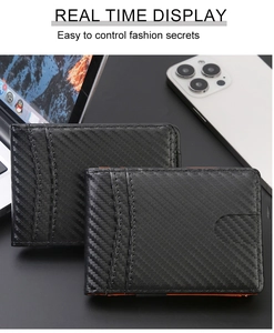 Detail shot of slim carbon fiber wallet with orange lining on a business desk