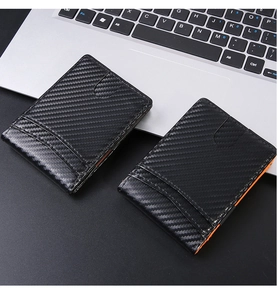 Macro shot of ultra-thin carbon fiber card holders with RFID blocking and orange accents