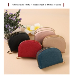 Detail of semi-circular accordion card holders in five colors with lychee pattern texture