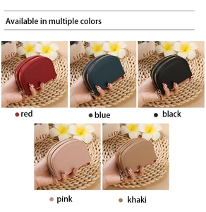 Detail view of multi-color shell-shaped credit card holders in textured lychee leather