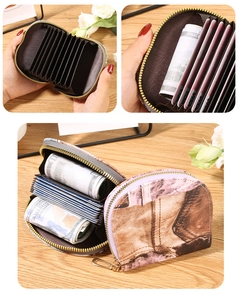 Detail view of denim fabric card holder with accordion slots and golden zipper