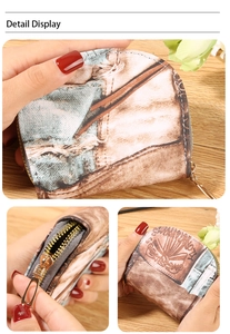 Detail view of a vintage denim print coin purse with a gold zipper and gray fabric lining