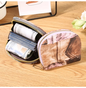 Detail showing high-capacity accordion interior design of floral canvas card wallet