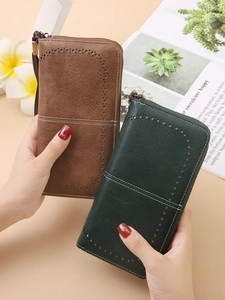 Retro RFID blocking long leather wallet with hollow cutout design and wrist strap