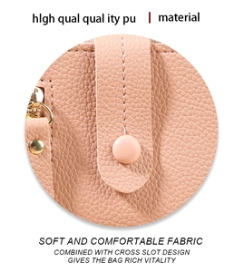 Detail of pink PU leather texture with lychee pattern and fine stitching on a woman purse