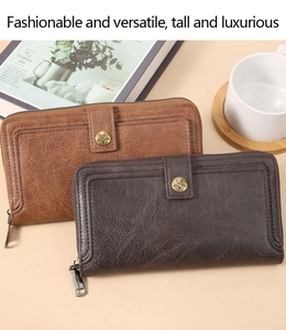 Close-up of vintage brown and coffee leather wallets with star buckle and metal zipper