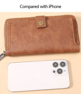 Size comparison between a long vintage leather wallet and an iPhone with dimensions