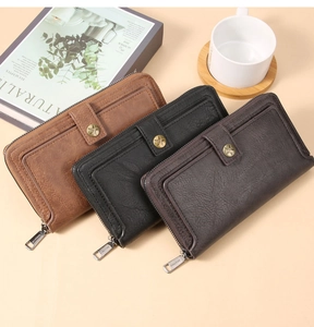 Three long leather wallets in brown, black and dark coffee with star buckle details