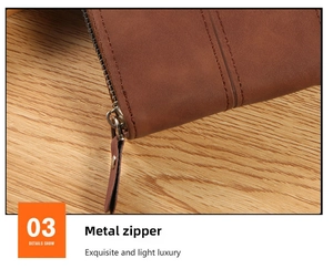 Close-up of durable metal zipper with leather pull on a brown vintage bifold wallet