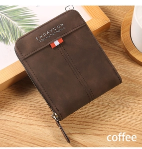Close-up of dark coffee frosted leather men's wallet with metal zipper and stitch detail