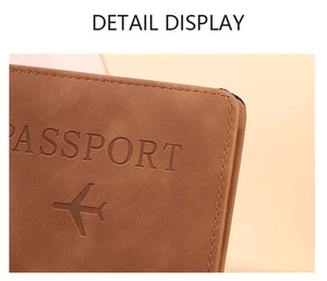 Detailed close-up of brown PU leather passport holder with debossed aircraft icon and text