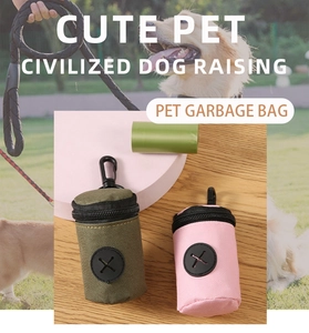 Portable pet waste bag dispensers in green and pink with durable metal carabiners