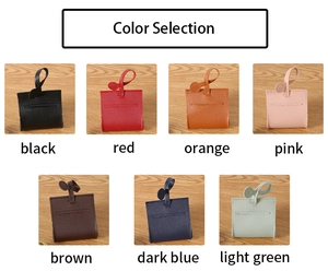 Collection of leather dog poop bag dispensers available in seven vibrant colors for outdoors