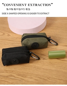 Detail of nylon pet waste bag dispenser with side X-shaped extraction hole and carabiner