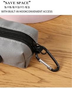 Detail of durable gray canvas pet waste bag dispenser with a metal carabiner hook