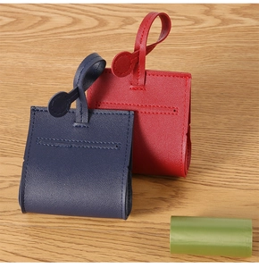 Detail of navy and red leather pet poop bag dispensers with high-quality stitching