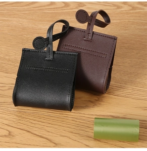 Detail of leather pet waste bag dispenser with fine stitching and portable strap