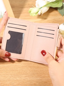 Pink minimalist bifold wallet for women featuring multiple card slots and a coin pocket