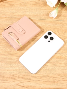 Compact pink pebbled leather bifold wallet for women shown next to a smartphone