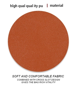 Macro detail of orange-brown PU leather texture with neat stitching on a long wallet