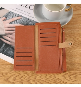 Detail of tan long wallet interior with multiple card slots and metal zipper pocket