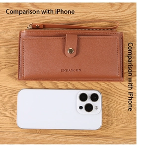Brown long wallet size comparison with iPhone showing card slots and zipper details