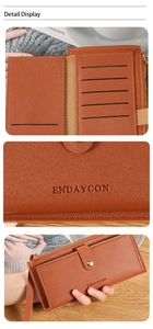 Close-up of caramel brown pebble leather wallet with multi-card slots and embossed logo