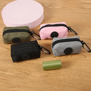 Outdoor dog waste bag dispenser in four colors with durable metal clip and rubber opening