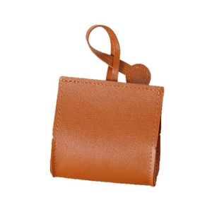 Brown leather dog waste bag dispenser with lychee texture and convenient carry loop