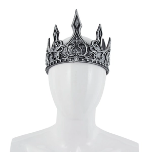European vintage king crown with medieval relief texture on a white model mannequin