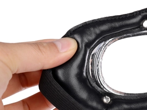 Detail of steampunk aviator goggles showing thick black leather padding and silver metal rims