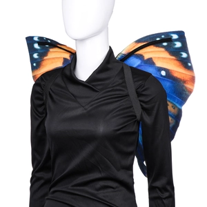 Detail of butterfly wings costume with orange and blue pattern and black elastic straps