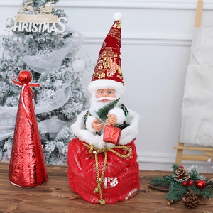 Peluche de Papá Noel bailando en bolsa de lentejuelas rojas con caja de regalo