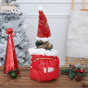 Gnomo de Navidad bailarín de peluche con gorro de lentejuelas rojas y saco festivo