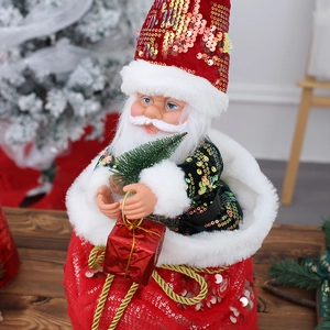 Papá Noel bailarín musical en saco de lentejuelas con mini árbol y caja de regalo roja