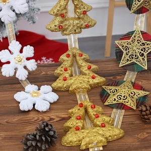 Christmas hanging ornament with glittery gold tree, white snowflake and plaid star