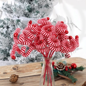 Christmas tree pick with red and white striped spiral curls and festive red jingle bells