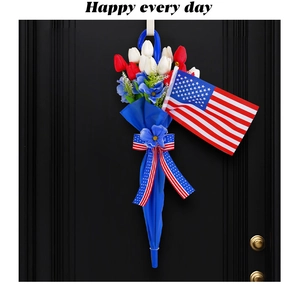Detail of Fourth of July door hanging featuring red white tulips and a mini US flag