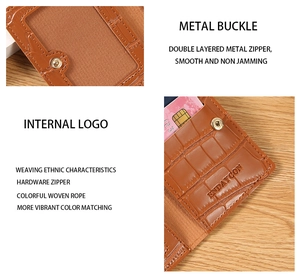 Detail of brown crocodile pattern wallet with metal buckle and clear ID window slots