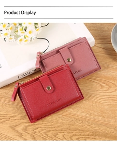 Detailed view of red and bean paste pink mini leather wallets with snap and zipper closure