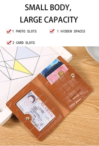 Detail of brown crocodile pattern leather card wallet with snap closure and card slots