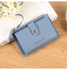 Detail of light blue PU leather wallet featuring snap closure and metal zipper pocket