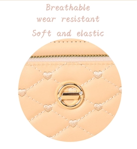 Détail du sac en cuir matelassé orange avec fermoir rotatif métallique et surpiqûres