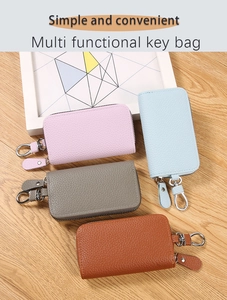Multi-colored PU leather key cases with silver swivel hooks and smooth zipper detail