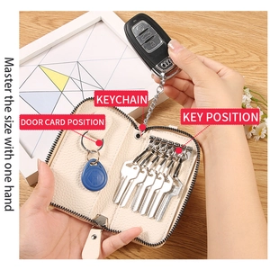 Detail of cream PU leather key case with six metal hooks and RFID card holder