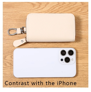 Compact PU leather key pouch in beige showing size comparison with a smartphone