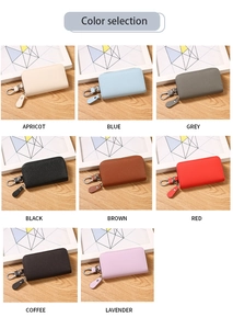 Detailed view of multi-color PU leather key cases with secure metal hooks and zippers