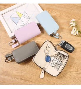 Macro shot of PU leather key case with 6 metal hooks and secure zipper closure