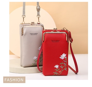 Detail of embroidered floral pattern and vintage metal clasp on lychee grain phone bags